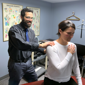 Pittsburgh Chiropractor Josh Cohen working on client